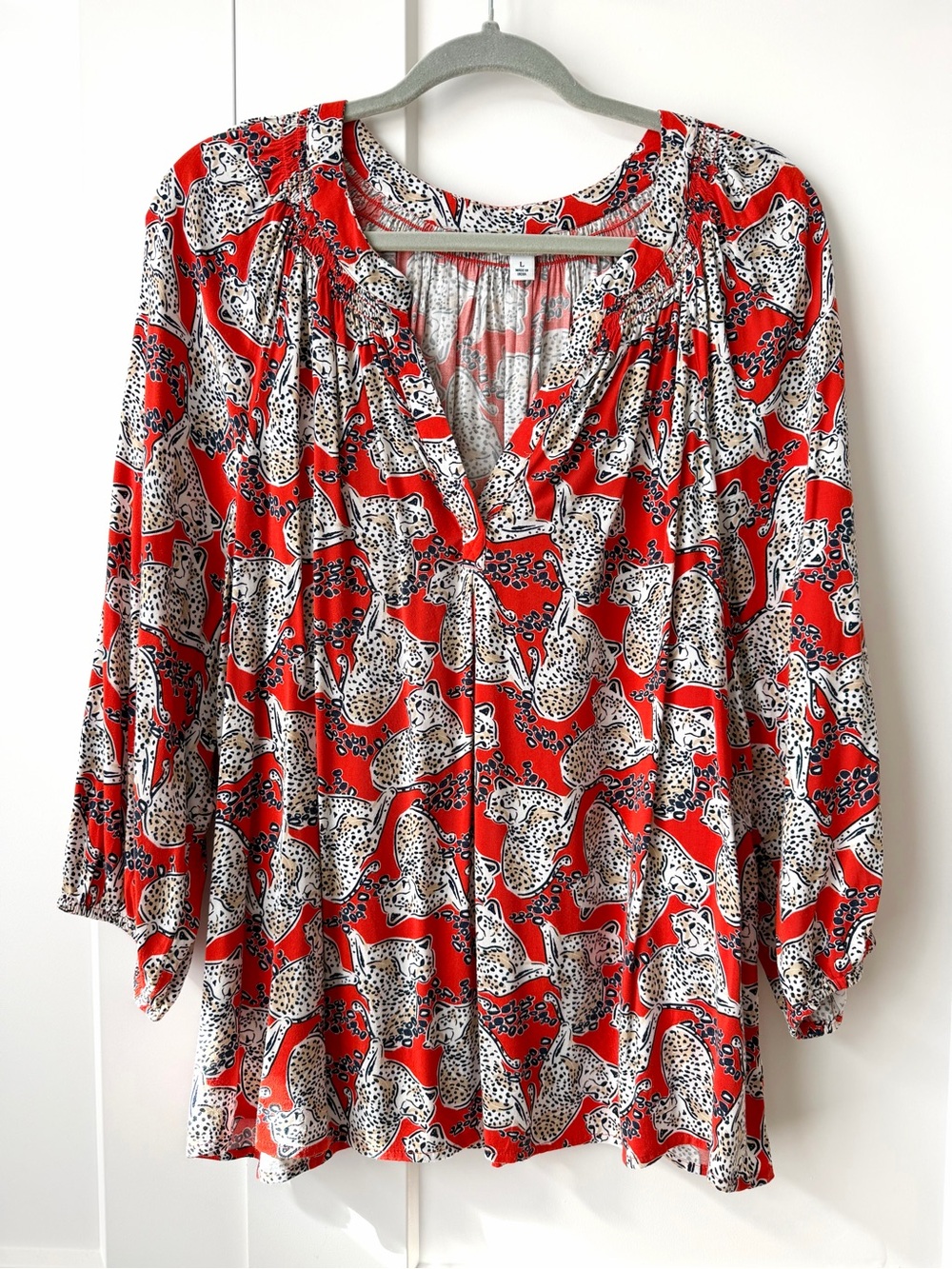 Orange cheetah print blouse
